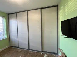 Taupe grey 4 door wardrobes with brushed champagne frames, fitted in Billingham